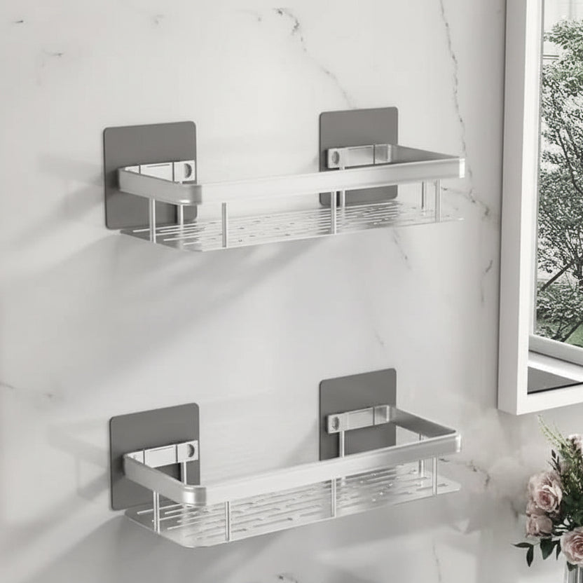 Two empty black shelves seen from the front on grey tiles beside a round mirror 17