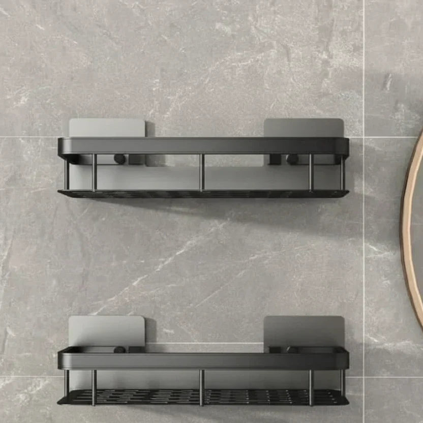 Close view of two silver-toned shelves with black mounting clips on grey adhesive plates 18