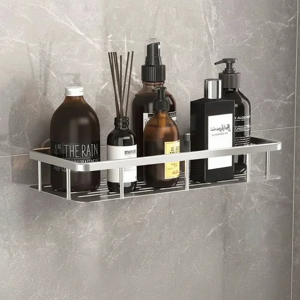 Black slatted shelf with a gripping adhesive plate, holding dark and amber bottles and a reed diffuser 5