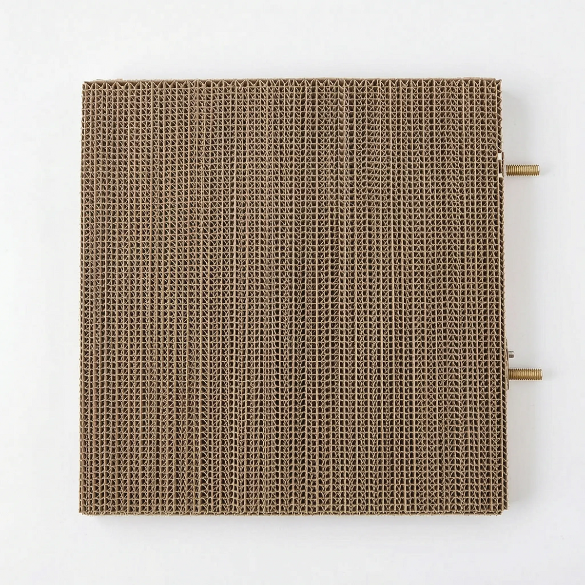 Top-down view of the square corrugated cardboard platform with two threaded metal bolts sticking out from one side. 5