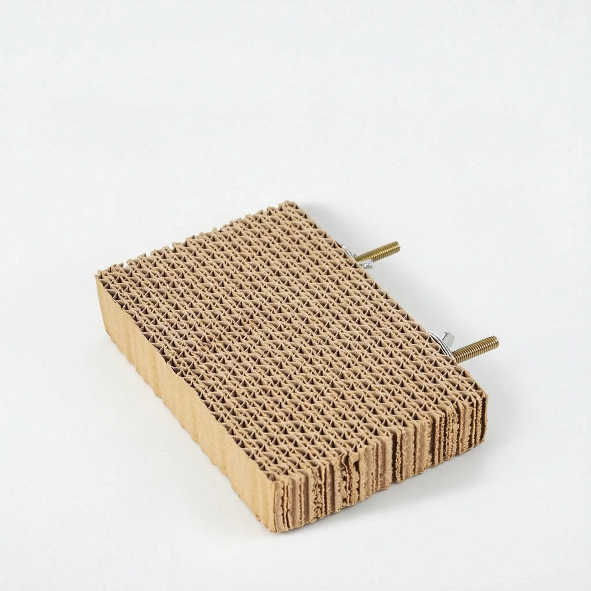 Smaller rectangular cardboard platform with two threaded brass bolts and nuts at the back, shown without cork stoppers. 7