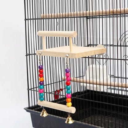 Wooden platform with a perch bar and a bead-and-bell swing, fitted to the side of a black cage. 1