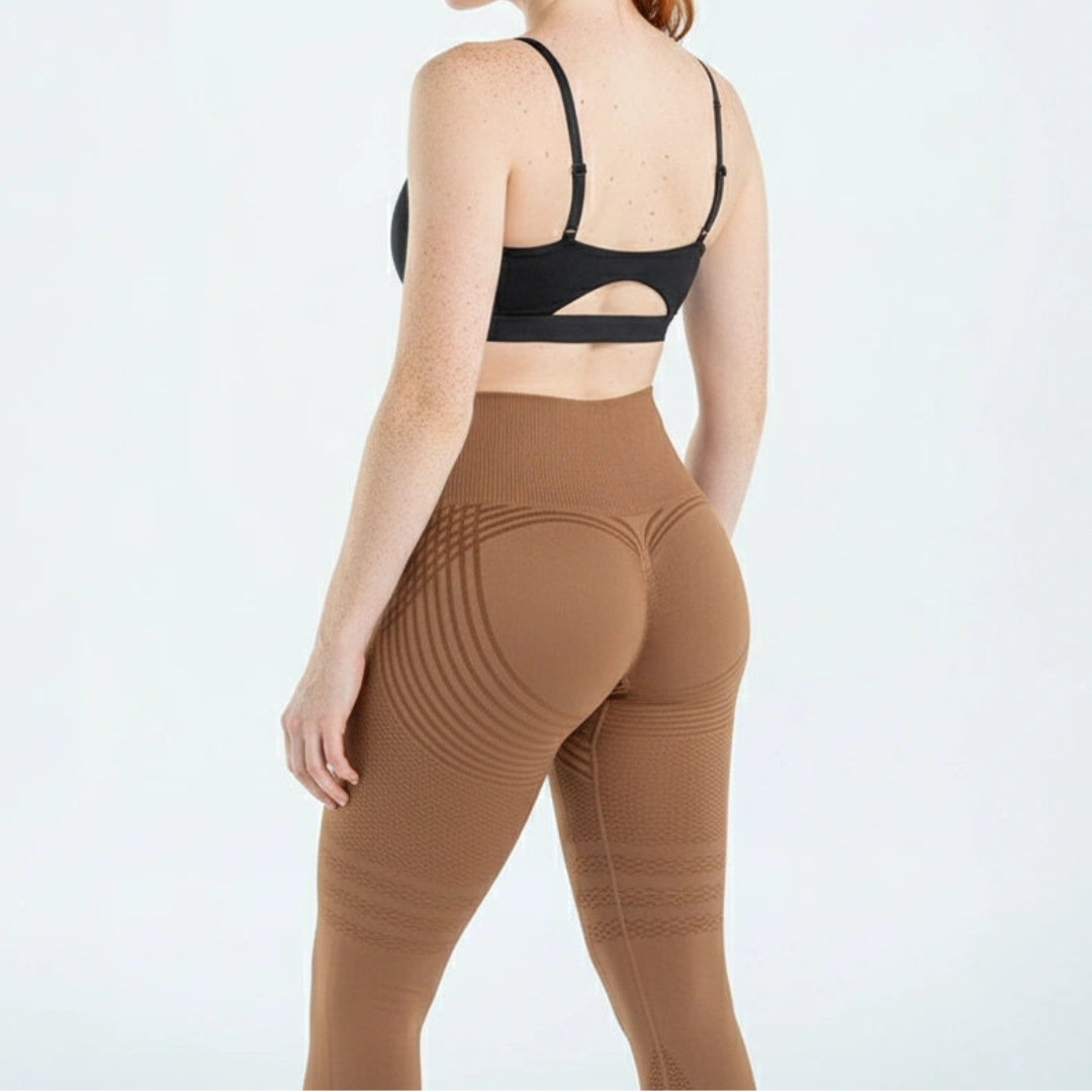 Back view of a model in tan brown leggings with tonal curved stripes, a gathered rear seam and textured thighs. 8