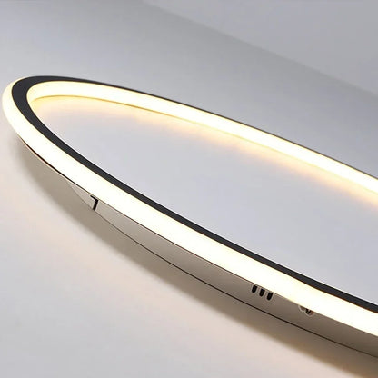Close-up of the light's glowing ring edge, showing the black trim and slim metal body 2
