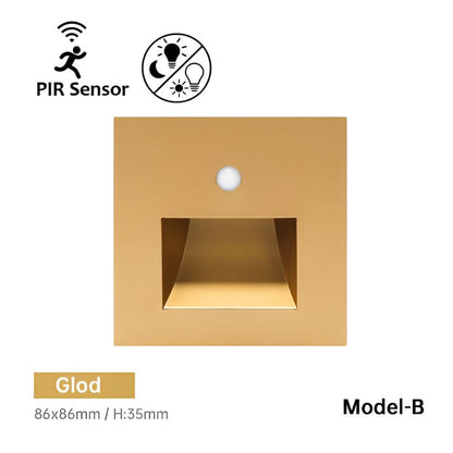 Front of the gold-coloured square wall light with a round sensor and a recessed light window 11