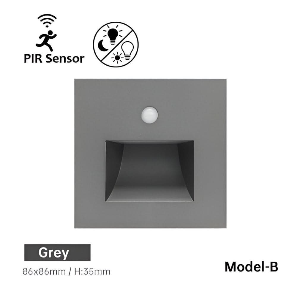 Front of the grey square wall light with a round sensor and a recessed light window 7