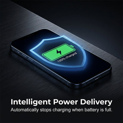 Phone lying on a dark surface with a glowing shield and green battery icon on its screen showing a full charge. 6
