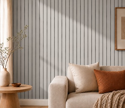 Grey slat wall in a living room beside a sofa, cushions and round side table 16