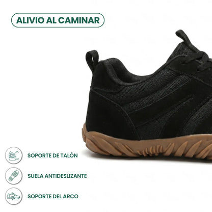 Close-up of the heel and side of the black mesh and suede shoe with a gum rubber sole, with feature icons. 22