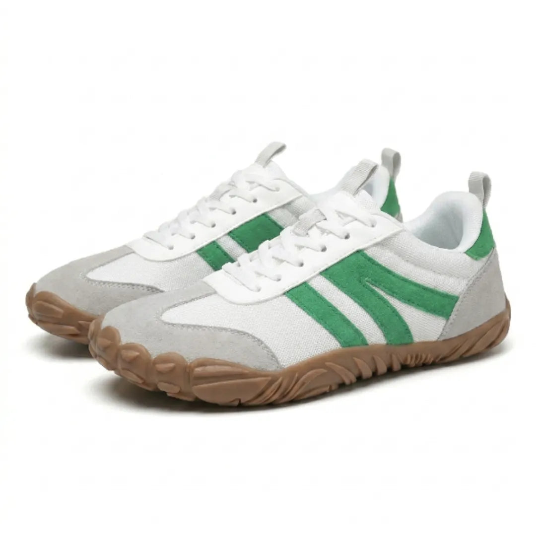 Pair of white mesh lace-up shoes with green suede stripes, grey toe caps and tan gum soles, in three-quarter view. 34