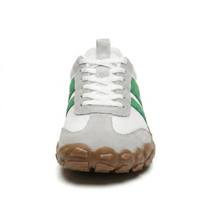 Front view of the white and green lace-up shoe showing the broad grey suede toe and chunky gum sole. 35
