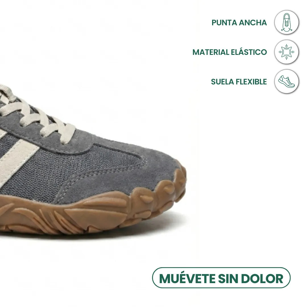 Close-up of the grey shoe's rounded front, with icons highlighting the roomy toe box, stretchy upper and flexible sole. 5