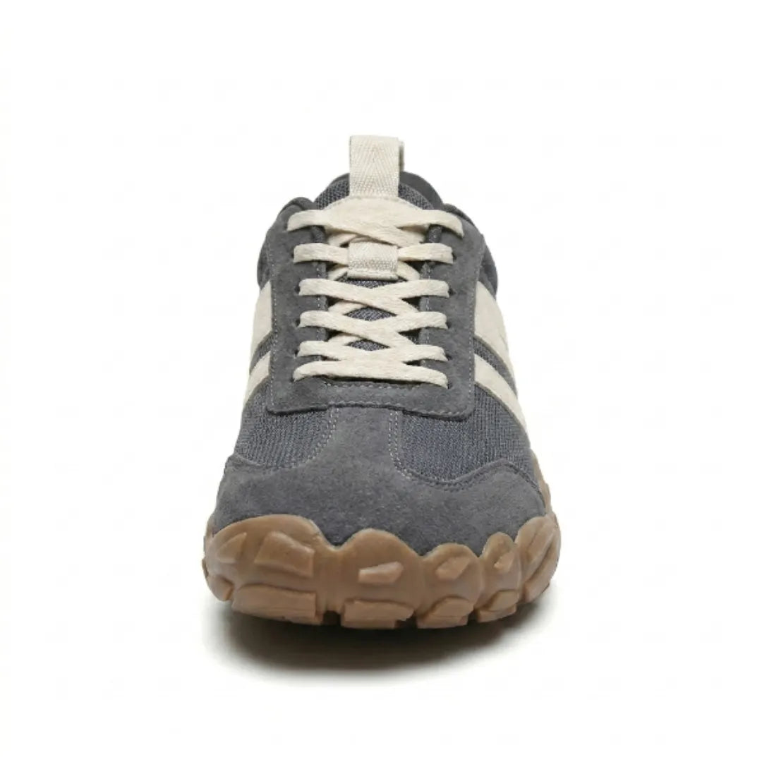 Front view of the grey shoe showing the wide rounded toe, criss-cross cream laces and chunky tan rubber sole edge. 8