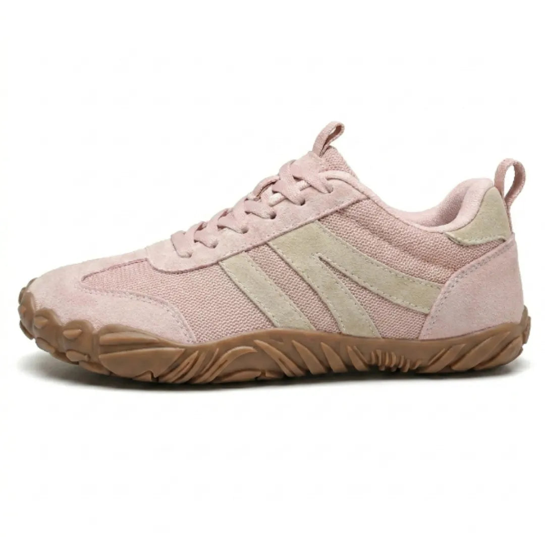 Side view of the pink version with beige suede stripes, matching pink laces and a tan flexible rubber sole. 10