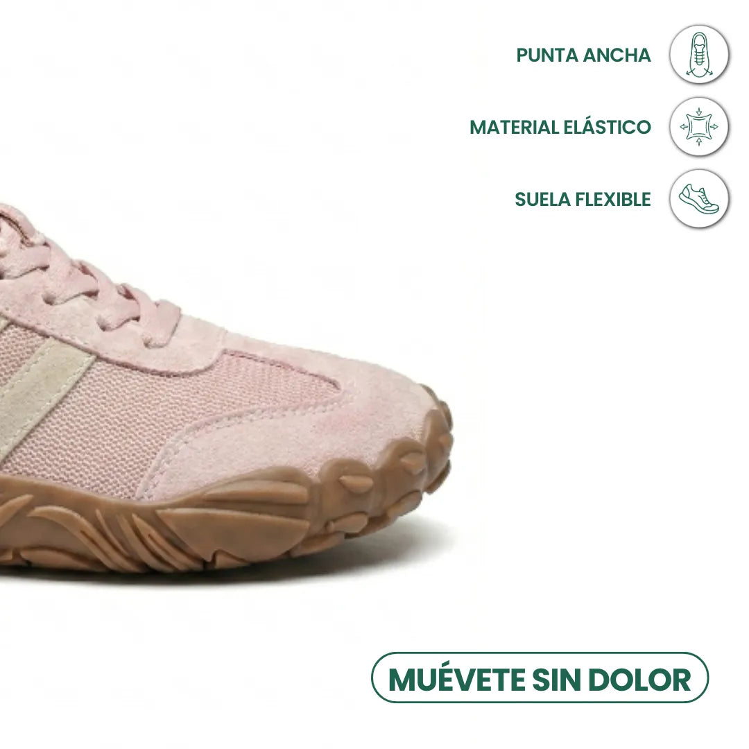 Close-up of the pink shoe's rounded front, with icons highlighting the roomy toe box, stretchy upper and flexible sole. 14