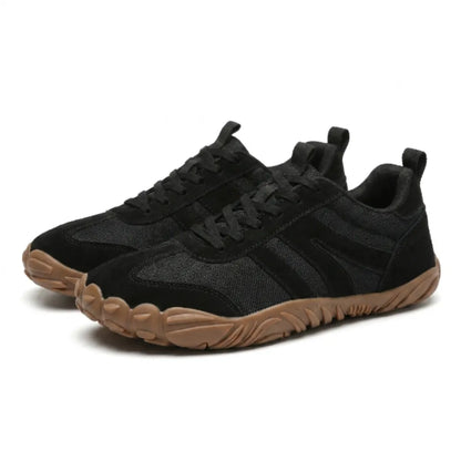 Pair of black mesh and suede lace-up shoes with tan gum soles, seen from a three-quarter front angle. 25