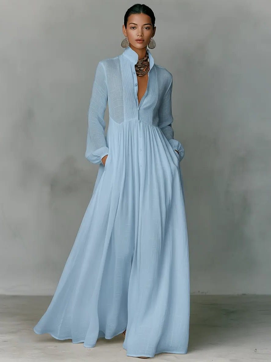 Full-length front view of the dress in pale blue, worn with statement earrings and a chunky necklace 3