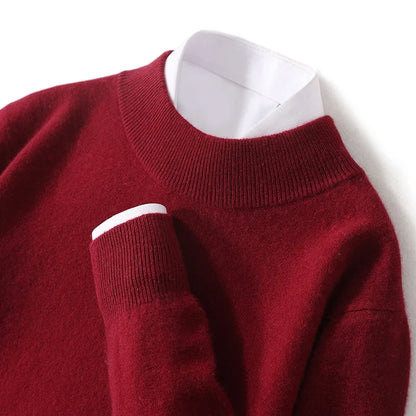 Close-up of burgundy red mock neck jumper showing ribbed collar and cuff over a white shirt 22