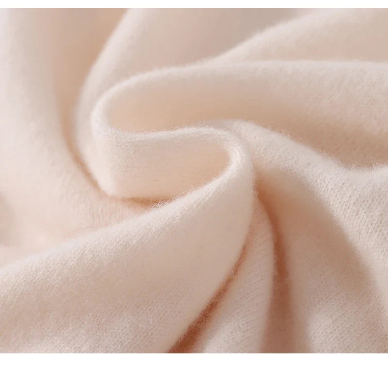 Close-up of soft, fluffy cream knit fabric folded in gentle waves 5