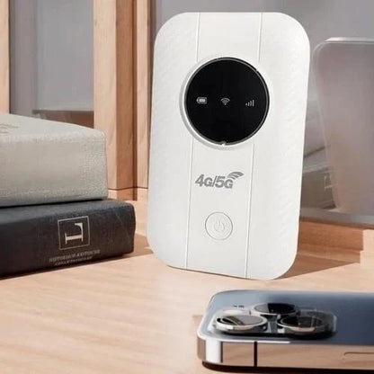 White hotspot standing upright on a wooden shelf between books and a smartphone with a triple camera 3