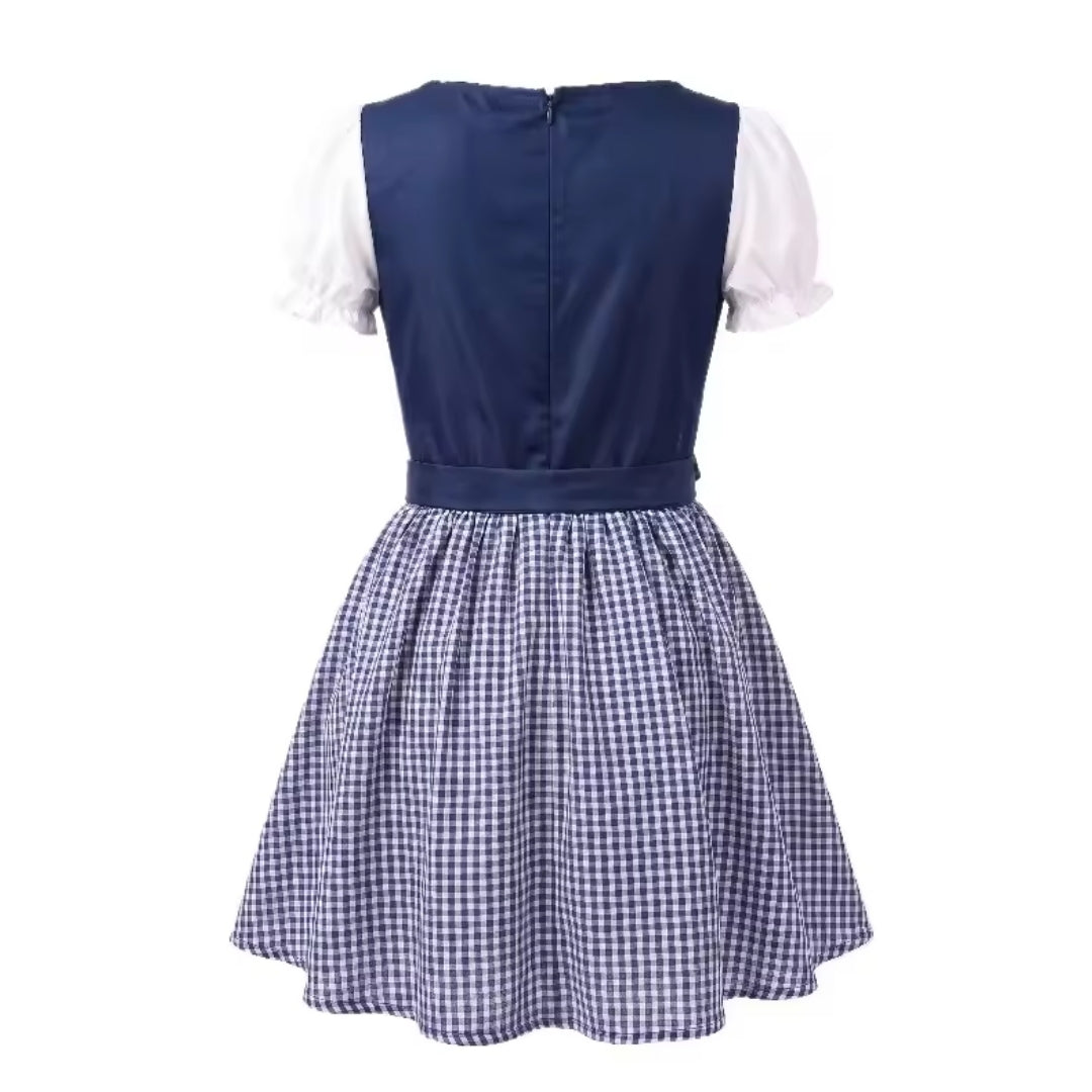 Back view of the navy dirndl showing the zip fastening, waist tie, short puff sleeves and gathered checked skirt. 6