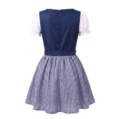 Back view of the navy dirndl showing the zip fastening, waist tie, short puff sleeves and gathered checked skirt. 6