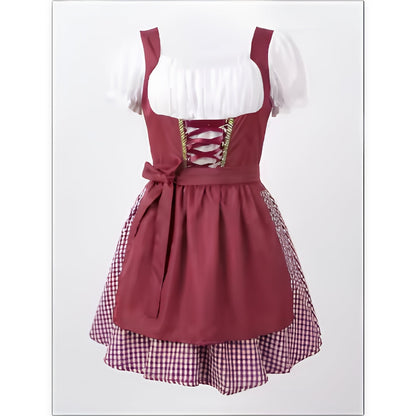 Burgundy dirndl on a mannequin, front view, showing white puff sleeves, laced bodice, tied apron and checked underskirt. 1