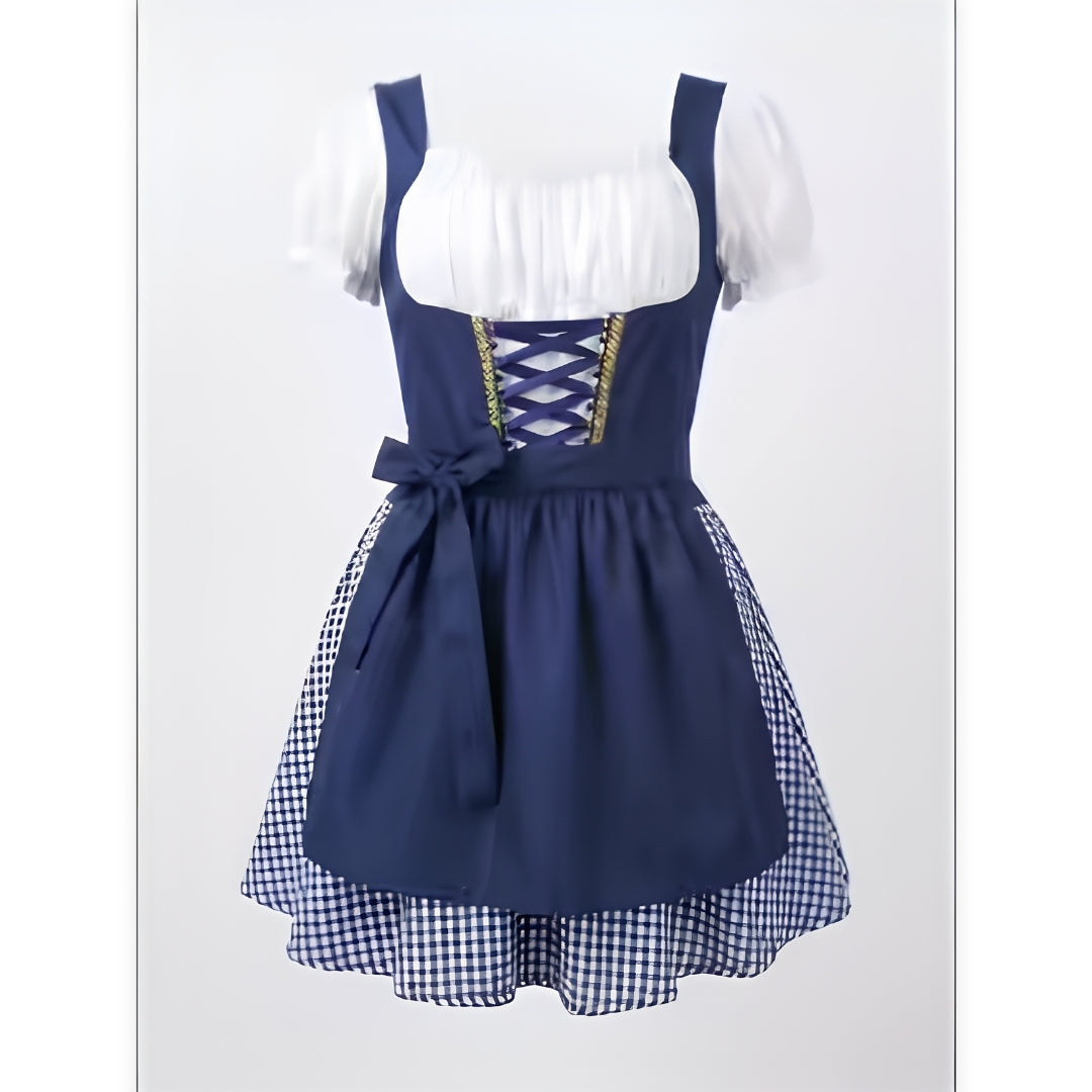 Navy blue version of the dirndl, front view, with white puff sleeves, lace-up bodice, bow-tied apron and checked skirt. 2