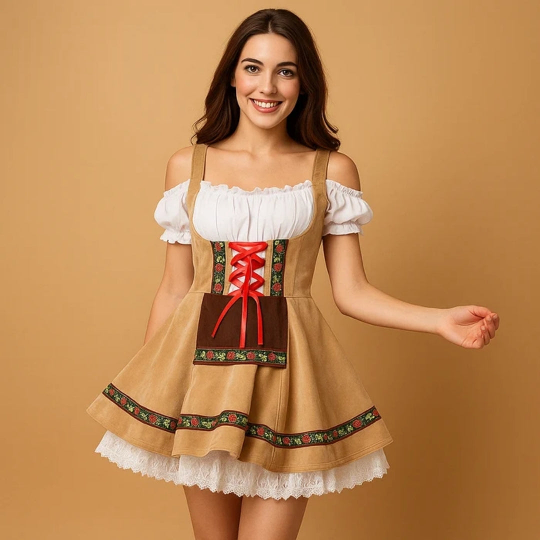 Smiling model in a tan dirndl with red satin lacing, floral ribbon trim, brown apron panel and layered white lace petticoat. 3