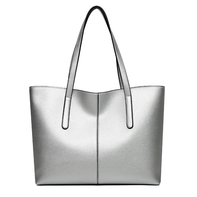 Silver tote bag seen straight from the front on a plain white background 9