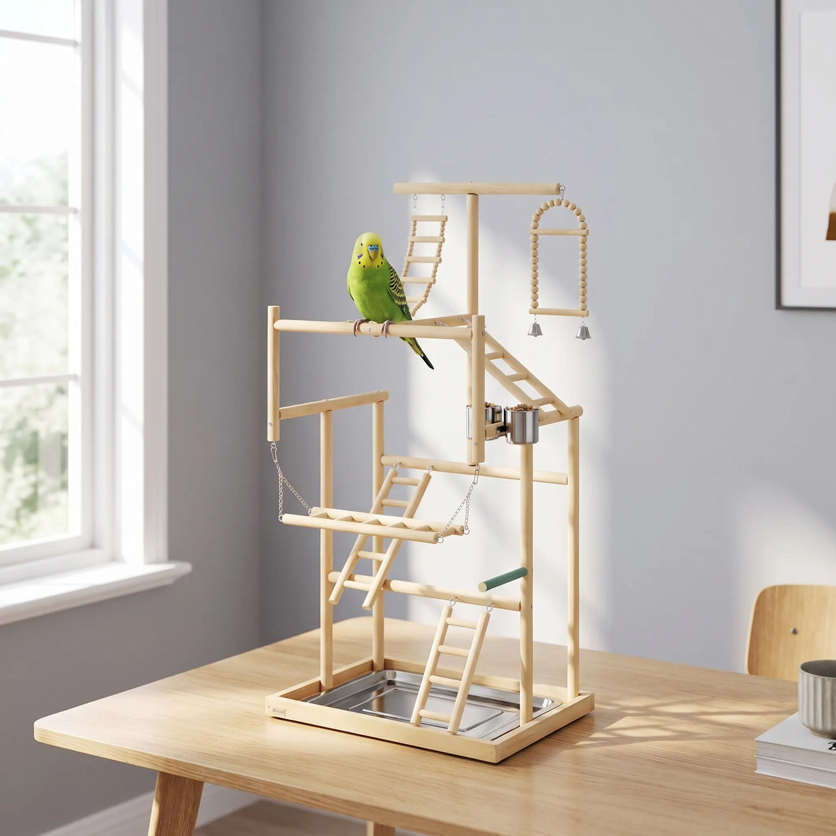 Bird play stand on a wooden table beside a window, with a green budgerigar perched on the middle bar. 2
