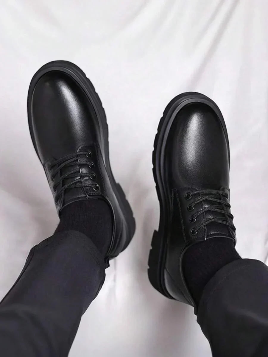 Top-down view of both shoes worn, showing rounded toes, laces and thick sole edges 4