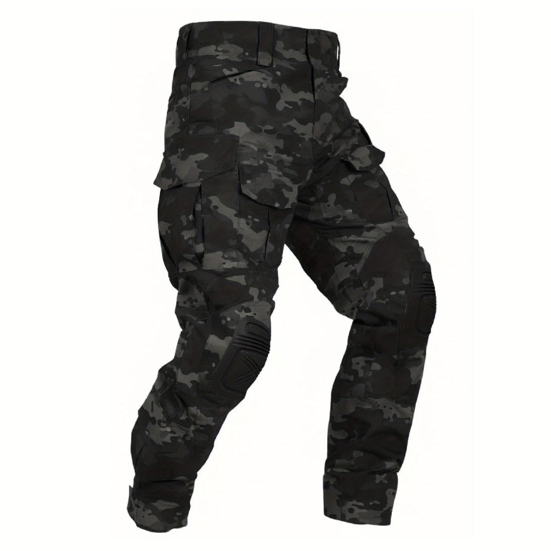 Flat view of the trousers in a black and grey camouflage pattern with black knee pads and flap cargo pockets. 14