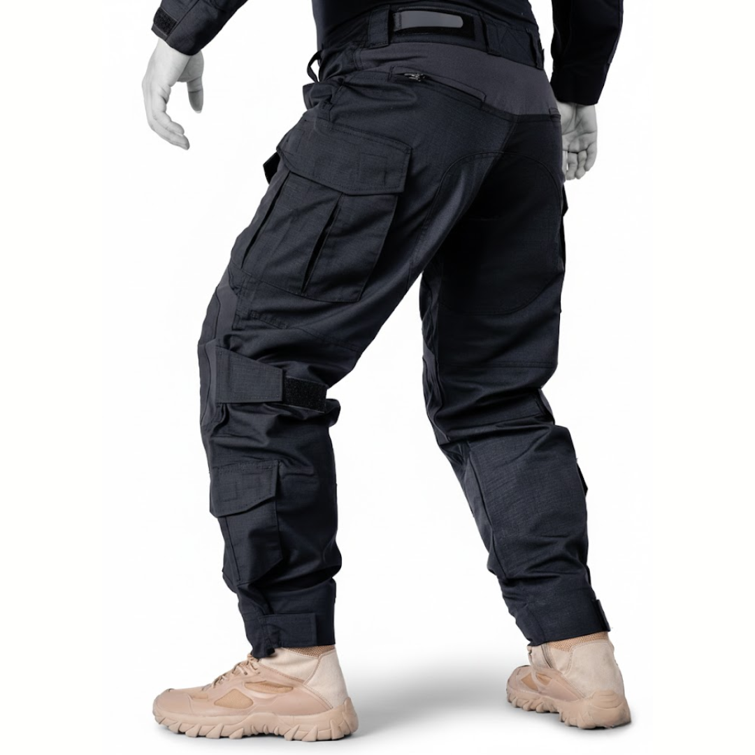 Rear three-quarter view of the black trousers on a mannequin, showing the back pocket, side cargo pocket and strapped knee area. 8