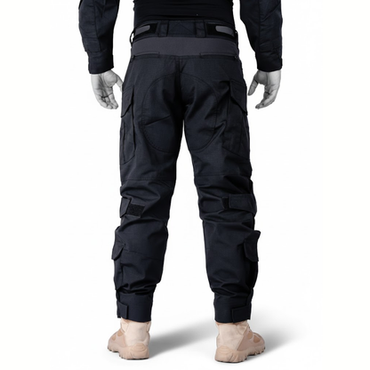 Straight back view of the black trousers on a mannequin, showing the waistband, rear panels, calf pockets and hook-and-loop cuffs. 10