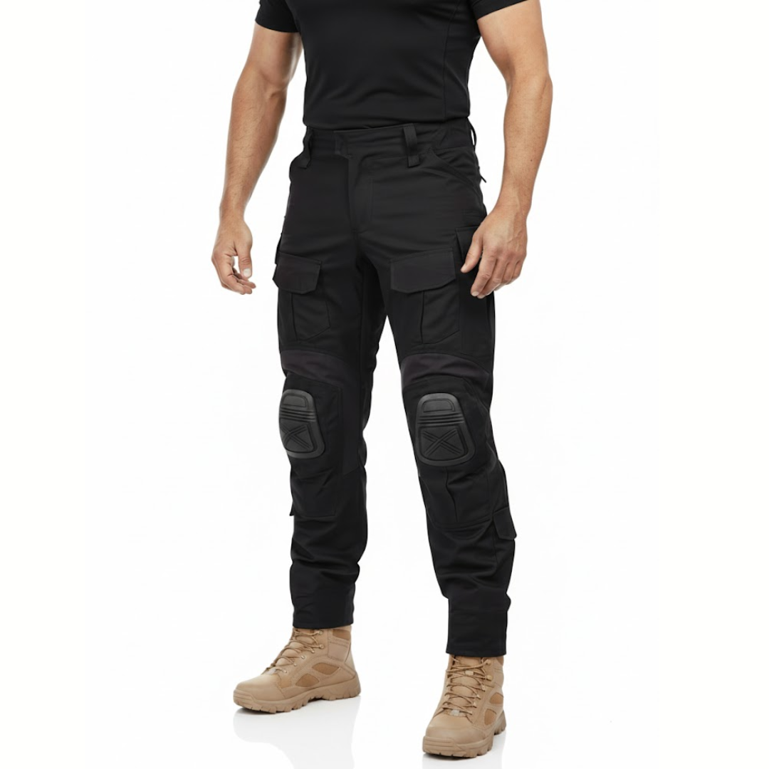 Model wearing the black cargo trousers with a black t-shirt and sand-coloured boots, shown from the front at an angle. 2