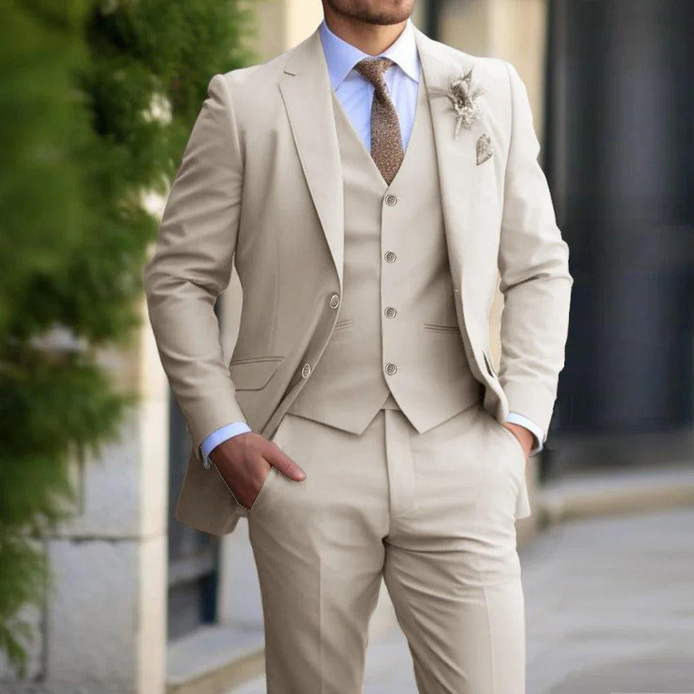 Close crop of a model in the beige suit, waistcoat and boutonniere, hands in pockets 2