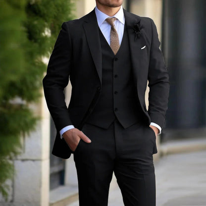 Model wearing the black version of the three-piece suit with white shirt and brown patterned tie 4