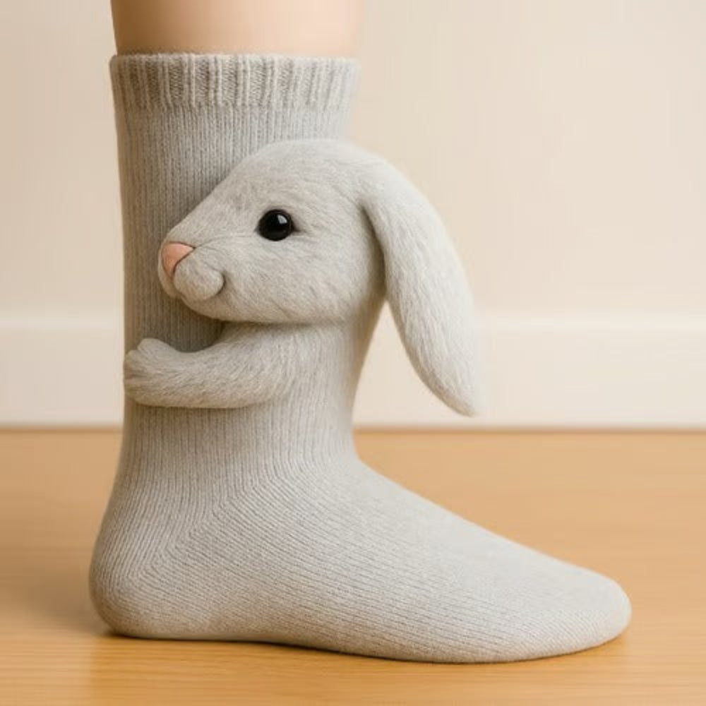 Light grey sock with a soft, fluffy lop-eared rabbit figure hugging the leg 7