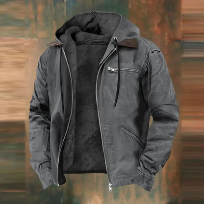Charcoal grey version of the hooded jacket, open at the front with fleece lining and zipped chest pocket, on a blurred backdrop. 4