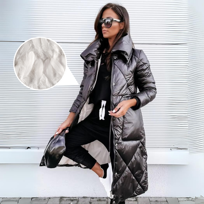 Black quilted long coat worn open by a woman, with a circular inset showing soft white feathers of the down filling. 6