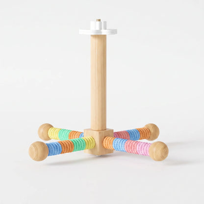 Perch version with four arms wrapped in multicoloured rope in yellow, green, orange, blue and pink, beside the wooden post and white mount. 4