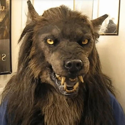 Close-up of the werewolf mask worn indoors, showing its long dark fur, pointed ears, yellow eyes and bared teeth. 3