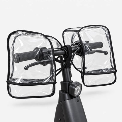 Rear view of both clear muffs fitted over the grips and brake levers of a black scooter, strap around the bar. 4