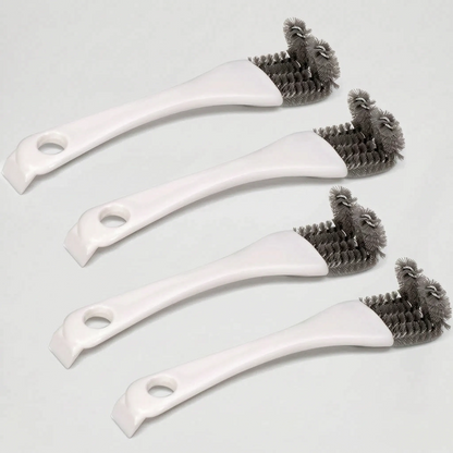 Four white brushes laid at a diagonal on a pale surface, showing the grey bristle heads, hanging holes and scraper ends. 4