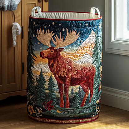 Tall quilted basket with an embroidered moose standing before pine trees, snowy peaks and a starry sky, with red trim and an open lining. 9