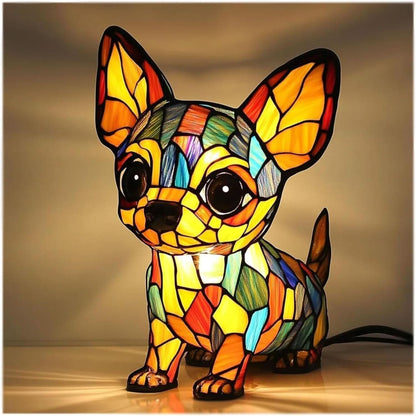 Chihuahua lamp with large butterfly-like ears and big eyes, lit yellow and orange, with the black power cable visible at the back. 10