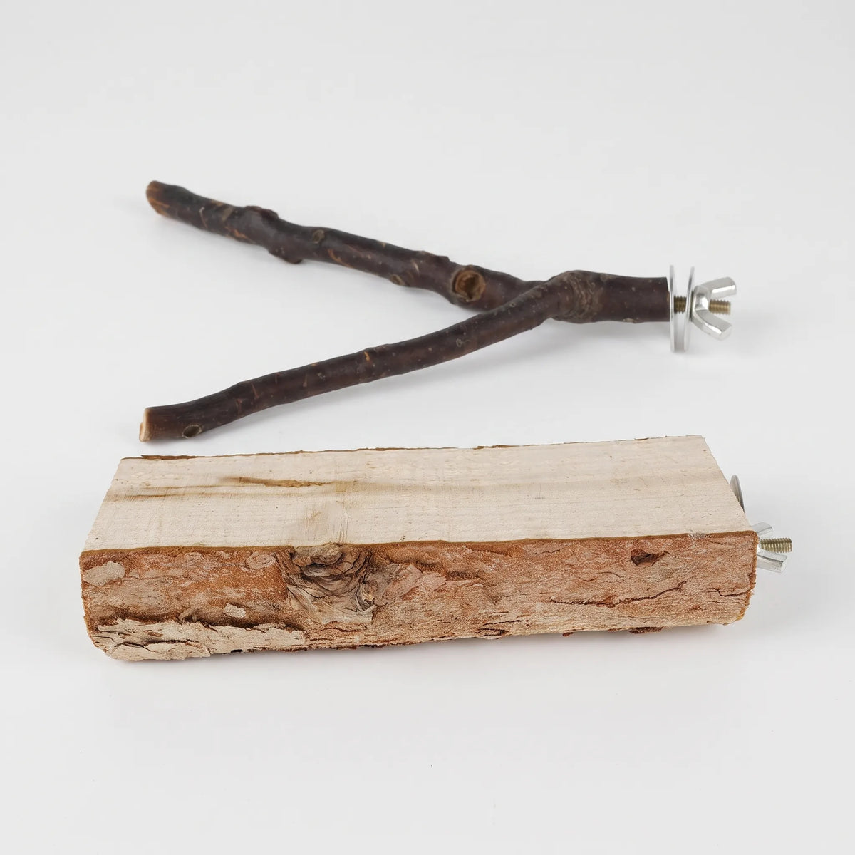 Forked wooden branch perch and a rough bark-edged wooden platform, each with a metal wing nut and washers, on white. 1