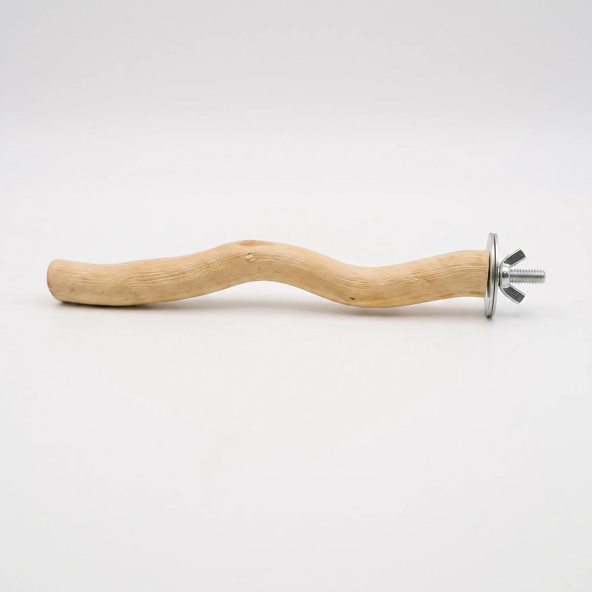 Short wavy wooden bird perch lying on a plain light background, with a metal washer and wing nut fixing at one end. 1