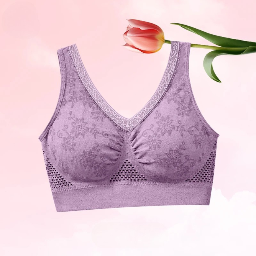 Lilac bra against a soft pink background with a red tulip resting across the top 6